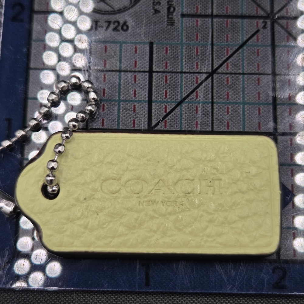 Coach Light Yellow Hangtag